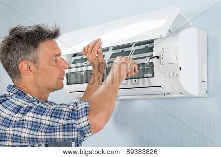 Technician Repairing Air Conditioner