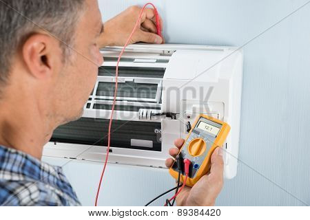 Technician Testing Air Conditioner