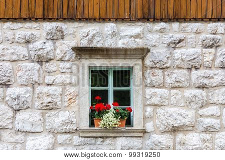 Traditional alpine stone window.