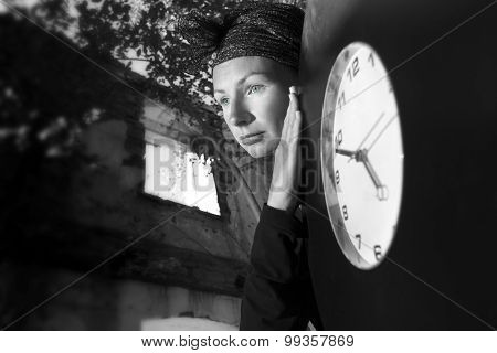 Girl On The Ruins Of The House With A Huge Clock In His Hands.
