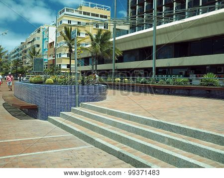 Grand Canary Island-may 9: A Cactus Garden Is Seen With Tourists Walking On Pedestrian Promenade Pla