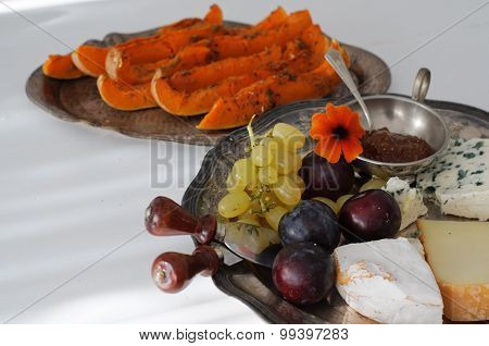Cheese Plate With Fall Fruits And Pumpkim