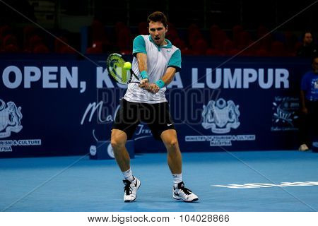 KUALA LUMPUR, MALAYSIA - SEPTEMBER 27, 2015: Mischa Zverev of Germany plays in his qualifying match at the Malaysian Open 2015 Tennis tournament held at the Putra Stadium, Malaysia.