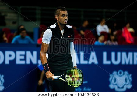 KUALA LUMPUR, MALAYSIA - SEPTEMBER 30, 2015: Nick Kyrgios of Australia reacts after a play in his match at the Malaysian Open 2015 Tennis tournament held at the Putra Stadium, Malaysia.