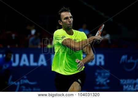 KUALA LUMPUR, MALAYSIA - SEPTEMBER 30, 2015: Ivo Karlovic of Croatia hits a forehand return in his match at the Malaysian Open 2015 Tennis tournament held at the Putra Stadium, Malaysia.