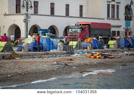 KOS, GREECE - SEP 28, 2015: Tents war refugees in the port of Kos island. Kos island is located just 4 kilometers from the Turkish coast, and many refugees come from Turkey in an inflatable boats.