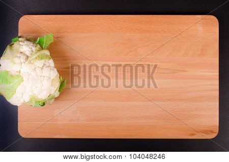 Organic  cauliflower on wooden background