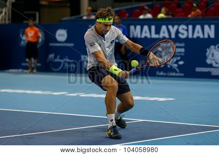 KUALA LUMPUR, MALAYSIA - OCTOBER 01, 2015: David Ferrer of Spain hits a backhand return in his match at the Malaysian Open 2015 Tennis tournament held at the Putra Stadium, Malaysia.