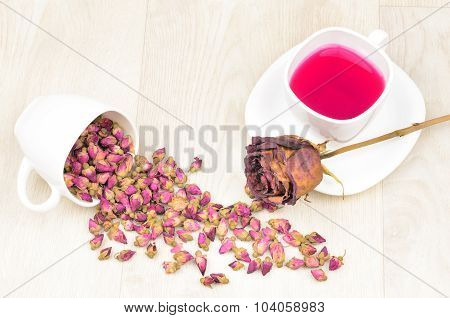 Tea Roses Scattered, Hot Tea And Dried Rose Flower On Wooden Table