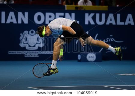 KUALA LUMPUR, MALAYSIA - OCTOBER 01, 2015: David Ferrer of Spain attempts a hit a return in his match at the Malaysian Open 2015 Tennis tournament held at the Putra Stadium, Malaysia.