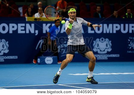 KUALA LUMPUR, MALAYSIA - OCTOBER 01, 2015: David Ferrer of Spain hits a forehand return in his match at the Malaysian Open 2015 Tennis tournament held at the Putra Stadium, Malaysia.