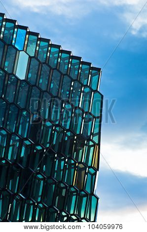 Harpa concert hall detail in Reykjavik harbor at sunrise, Iceland