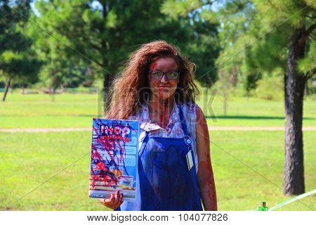 MUSKOGEE, OK - Sept. 12: An actor dressed as a zombie hides in a field and waits for the next runner during the Castle Zombie Run at the Castle of Muskogee in Muskogee, OK on September 12, 2015. 
