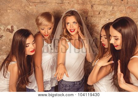 Satisfyed Cute Bride Showing Her Bridesmaids Wedding Ring