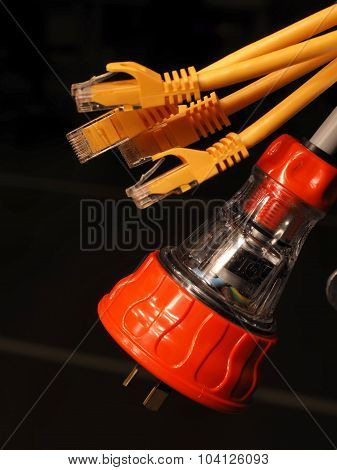 Orange and clear industrial 240V power and several yellow data plugs