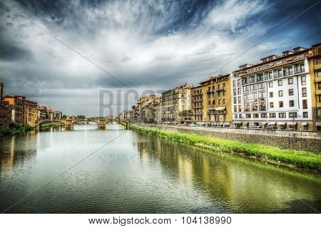 Arno River Under A Dramatic Sky In Florence