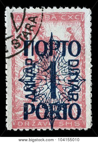 YUGOSLAVIA - CIRCA 1919: A stamp printed in Yugoslavia shows a man breaks the circuit, a symbol of freedom, circa 1919