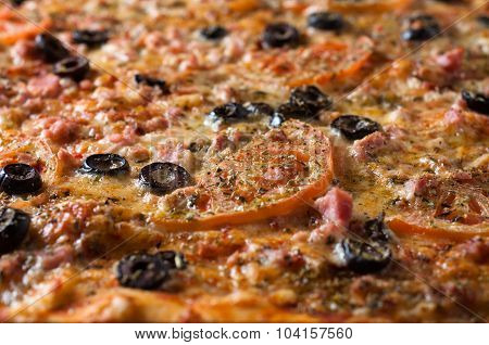 Close Up Of A Delicious Pizza With Tomatoes And Olives