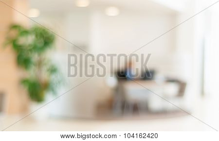 blurred office background , office worker on the computer