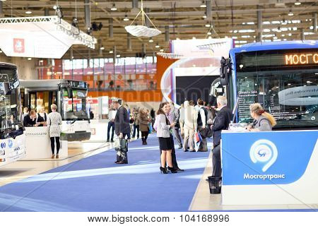 MOSCOW, RUSSIA - CIRCA NOVEMBER, 2014: People visit ExpoCityTrans exhibition. ExpoCityTrans is a unique event in the sphere of public transport consisting of an exhibition and business events.