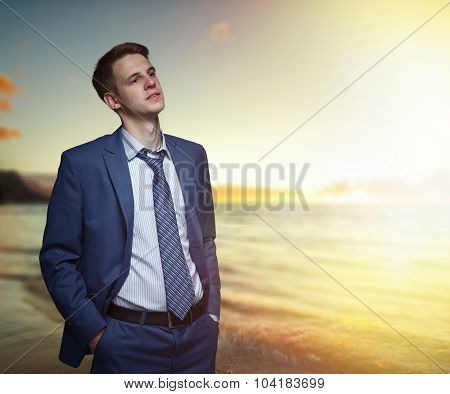 Office Worker On The Beach During Sunset.
