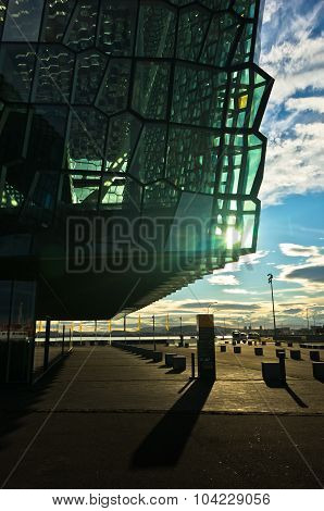 Harpa concert hall in Reykjavik harbor at sunrise, Iceland