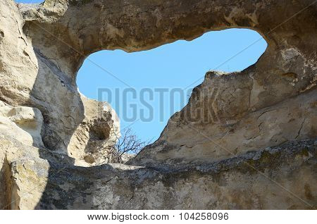 Blue Sky Through Hole In The Wall In Old Cave City Uplistsikhe, Georgia