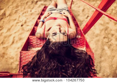 Long Hair Girl Relaxing On The Beach