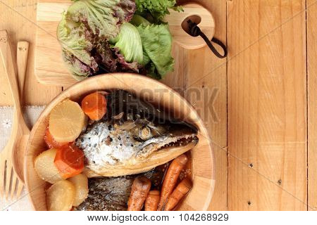 Salmon Head Cooked Of Tari Yaki Sauce With Fresh Vegetables.