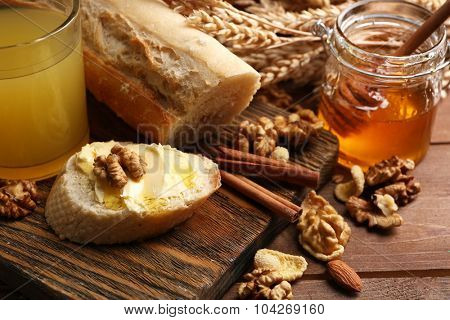 Healthy breakfast with bread, honey, nuts. Country breakfast concept