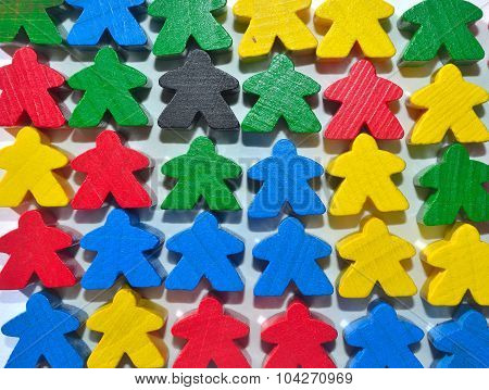 Little multi coloured wooden human figures or meaples