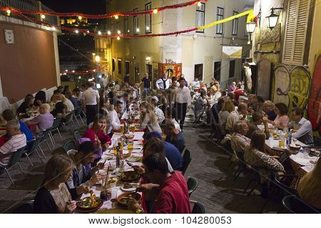 People Having Dinner Outdoor In Calcada Do Duque In Lisbon