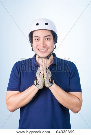 Asian Guy Welcome Greeting Sawasdee With Bicycle Helmet And Gloves,