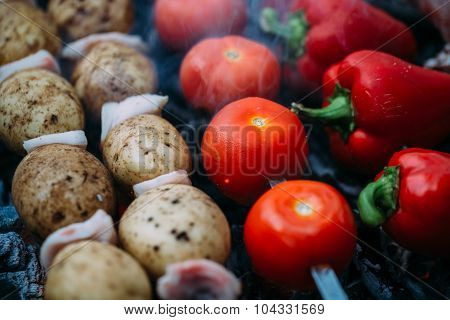 Veggies on barbeque tomatoes, red bell pepper, potatoes
