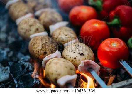 Veggies on barbeque tomatoes, red bell pepper, potatoes