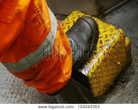 Driller's Leg Standing On The Equipment Cover In Driller Shack