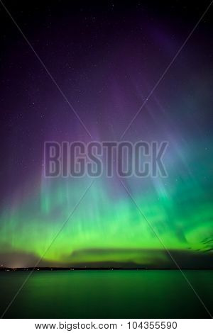 Northern lights over lake in finland