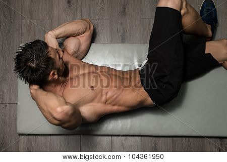 Healthy Man Doing Abdominal Excerise On Foor