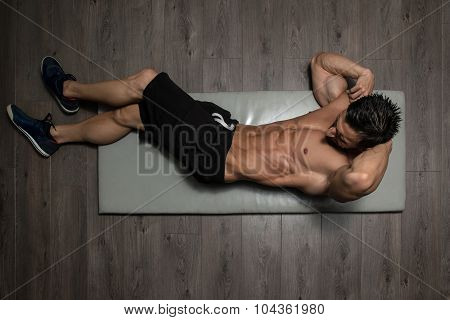 Healthy Man Doing Sit-ups On Foor