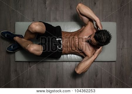 Healthy Man Doing Abdominal Excerise On Foor