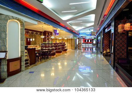 DUBAI, UAE - SEPTEMBER 08, 2015: Dubai Airport interior. There are a lot of restaurants, bars, cafes and shops in Dubai International Airport. Almost all of them are open twenty-four hours.