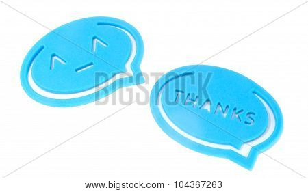 Smile and Thanks clip-on letter bookmarks on white background.