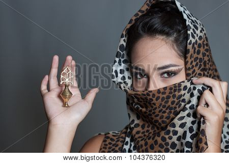 Indian Girl Face Covered Leopard Spotted Veil Holding Kajal Pot