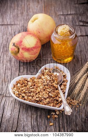 Granola with honey. Breakfast food background.