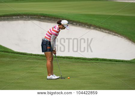 KUALA LUMPUR, MALAYSIA - OCTOBER 09, 2015: South Korea's Chella Choi putts at the 18th hole green at the KL Golf & Country Club at the 2015 Sime Darby LPGA Malaysia golf tournament.
