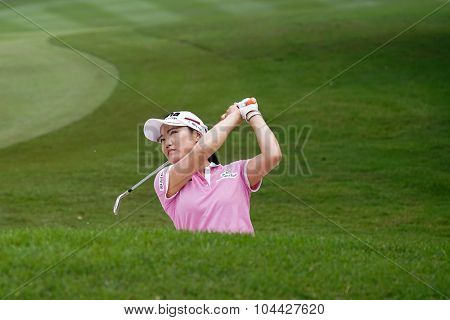 KUALA LUMPUR, MALAYSIA - OCTOBER 10, 2015: South Korea's So Yeon Ryu plays out of the sand trap of the 18th hole of the KL Golf & Country Club during the 2015 Sime Darby LPGA Malaysia golf tournament.