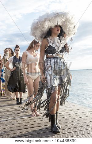 Models Walk An During  Outdoor Fashion Show With Clothing Made Out Of Recycled Materials Was Held In