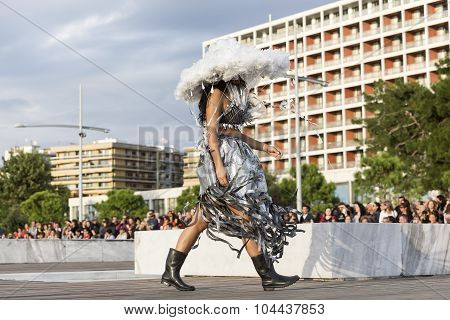 Models Walk An During  Outdoor Fashion Show With Clothing Made Out Of Recycled Materials Was Held In