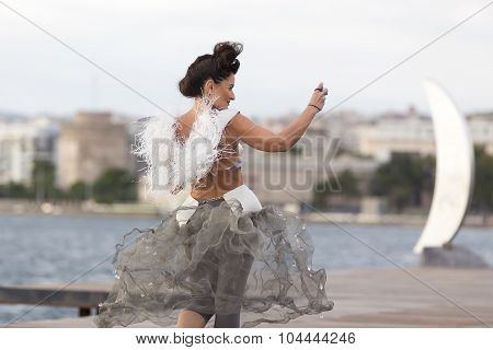 Models Walk An During  Outdoor Fashion Show With Clothing Made Out Of Recycled Materials Was Held In