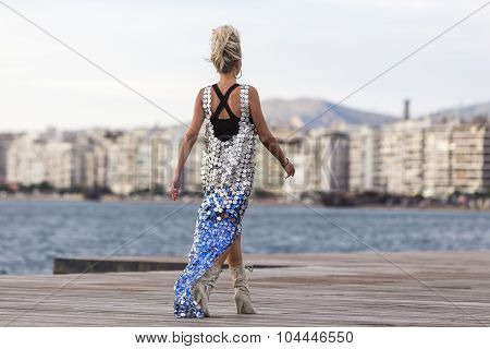 Models Walk An During  Outdoor Fashion Show With Clothing Made Out Of Recycled Materials Was Held In